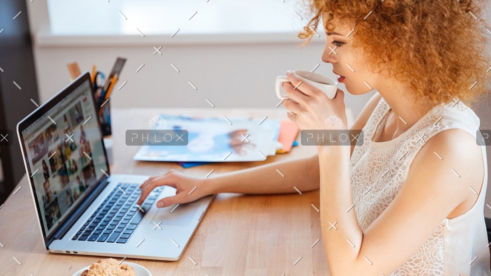 demo-attachment-410-woman-photographer-drinking-coffee-and-working-PJNBP6U